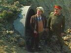 [ The Doctor and the Brigadier emerge from the tunnel.]